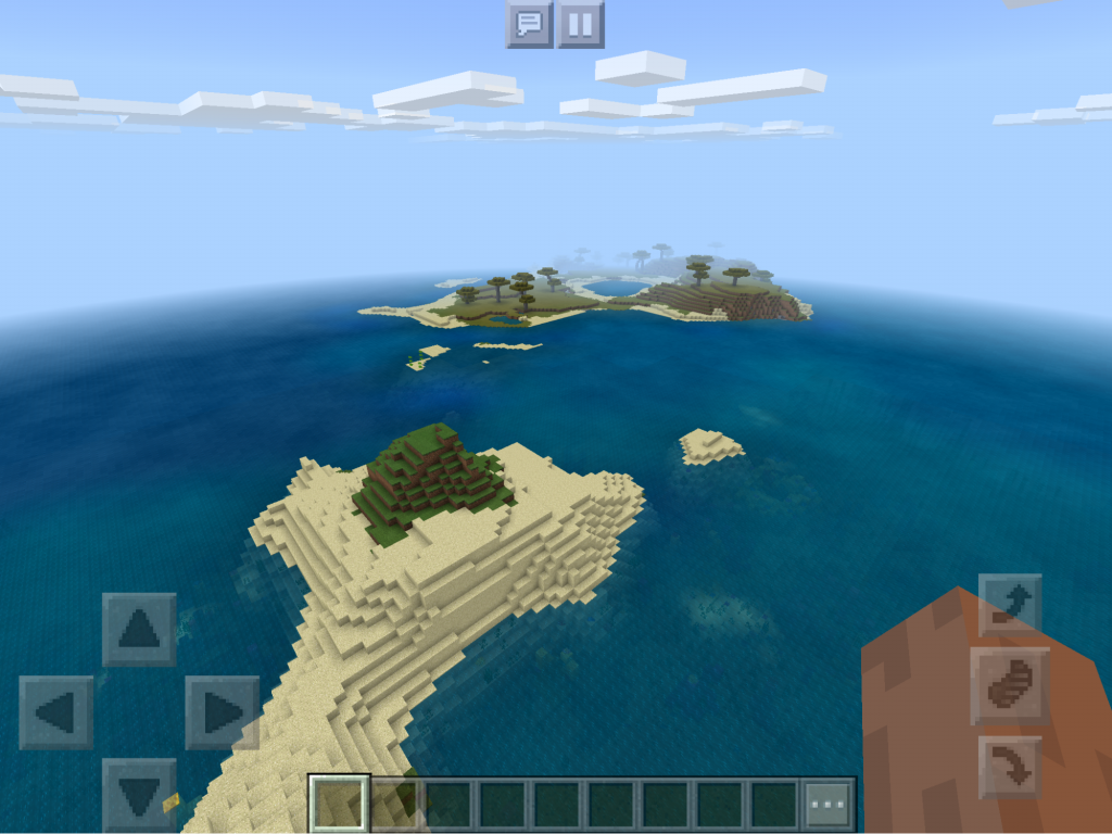 sandy island with savanna islands in the background.