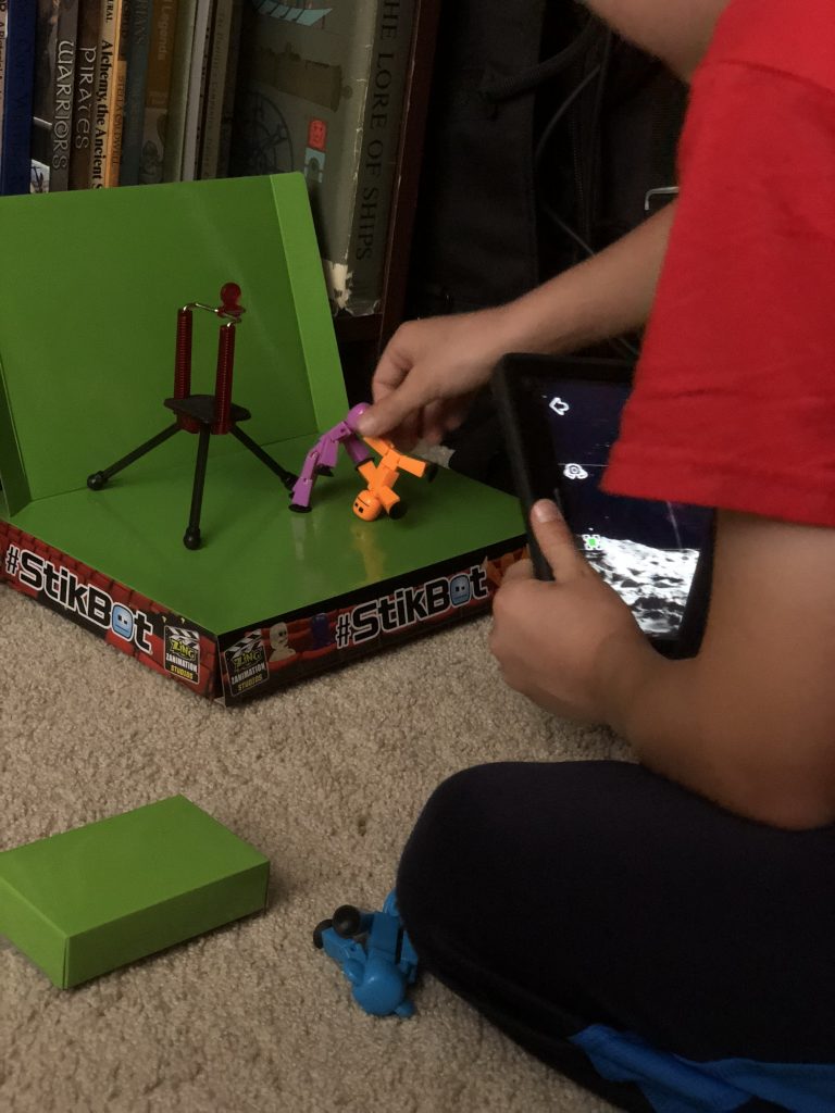 Kid playing with stikbots
